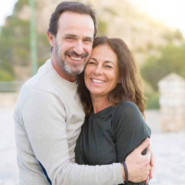 Middle Aged Couple Hugging Outdoors